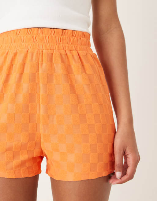 Glamorous Track shorts with back patch pocket in orange checkerboard, 5 of 5