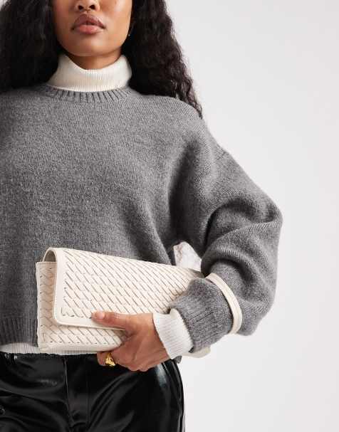 Glamorous woven clutch bag in cream - view 1