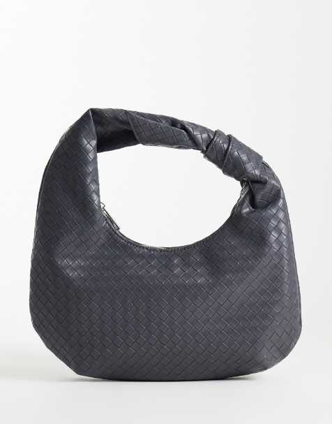 Glamorous woven knot shoulder bag in gray - view 1