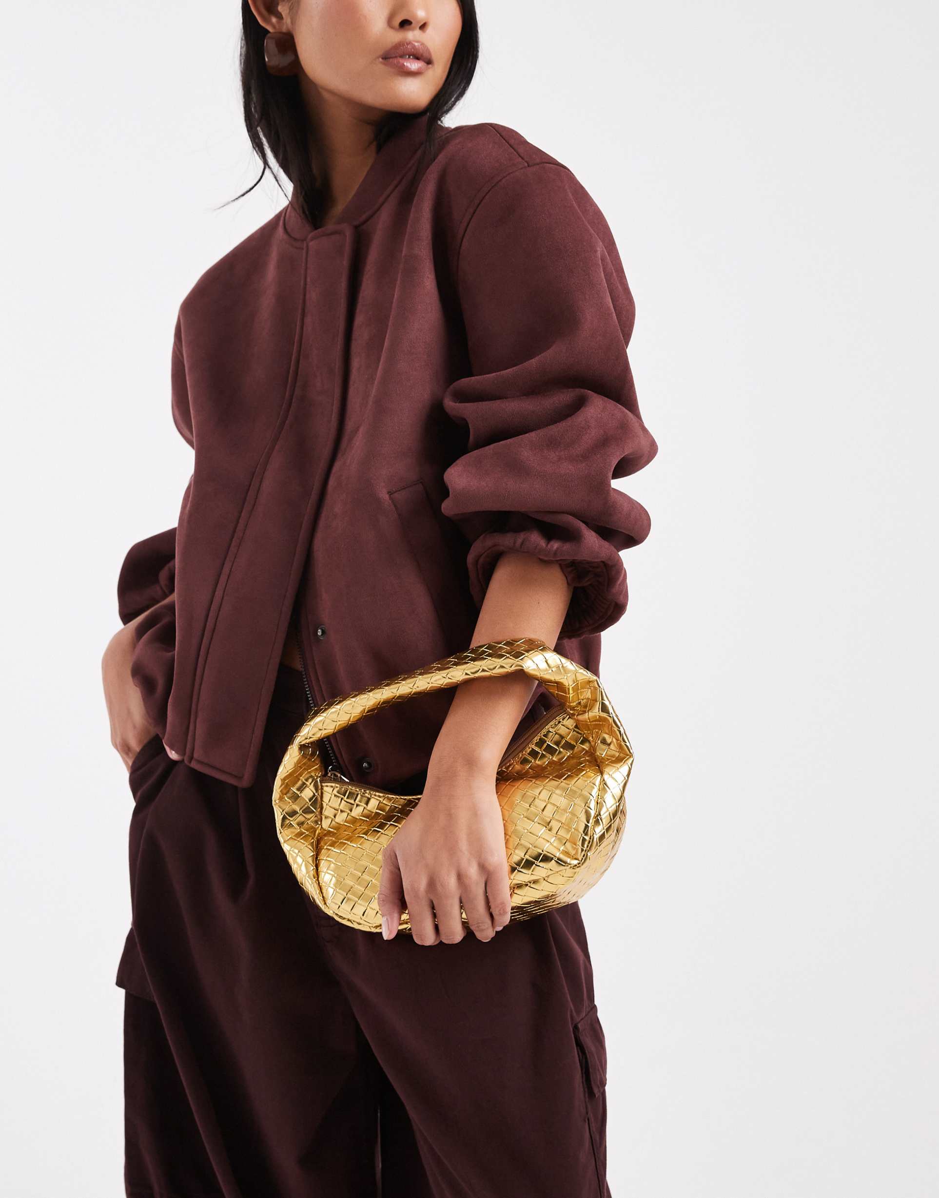 glamorous woven purse in gold