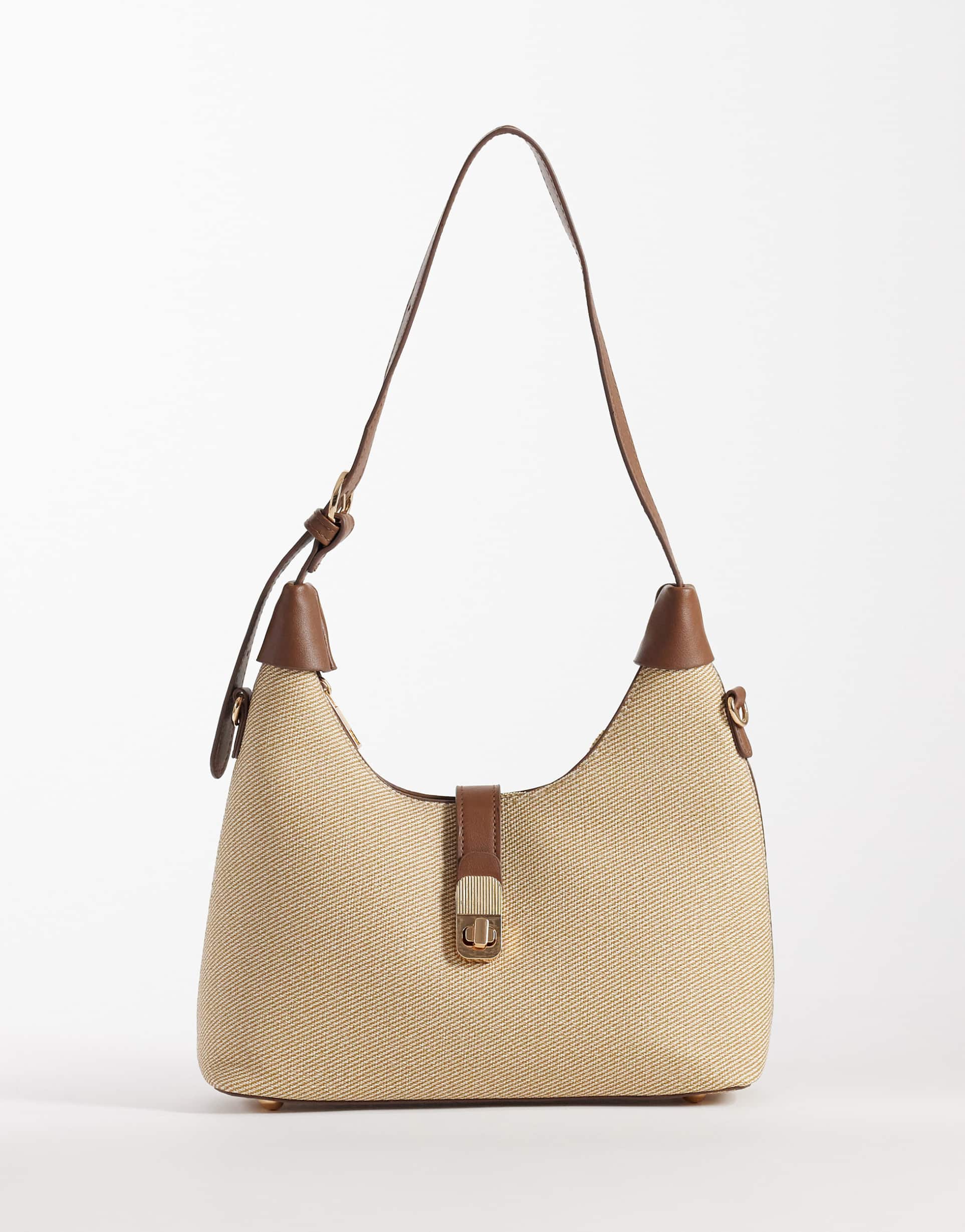 glamorous woven raffia shoulder bag with faux leather details in cream