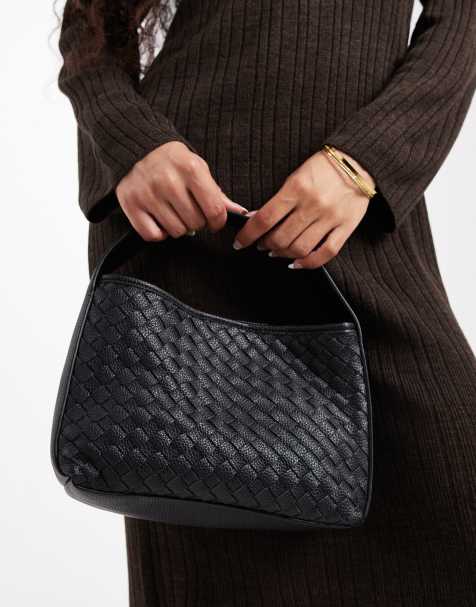 Glamorous woven top handle bag in black - view 1