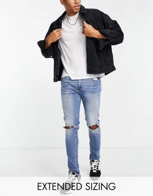 Светлые джинсы Голубые джинсы скинни с рваными коленями ASOS DESIGN-Голубой