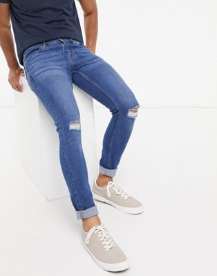 фото Голубые супероблегающие джинсы с рваными коленями threadbare-синий