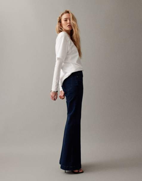 Good American good legs flare compression jeans in dark blue wash
