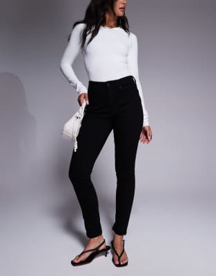 Good American Good Legs skinny jeans in black - view 1