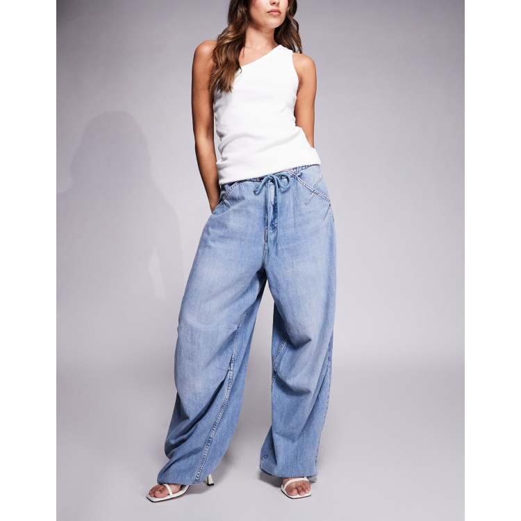 Good American lite linen look denim parachute pants in mid