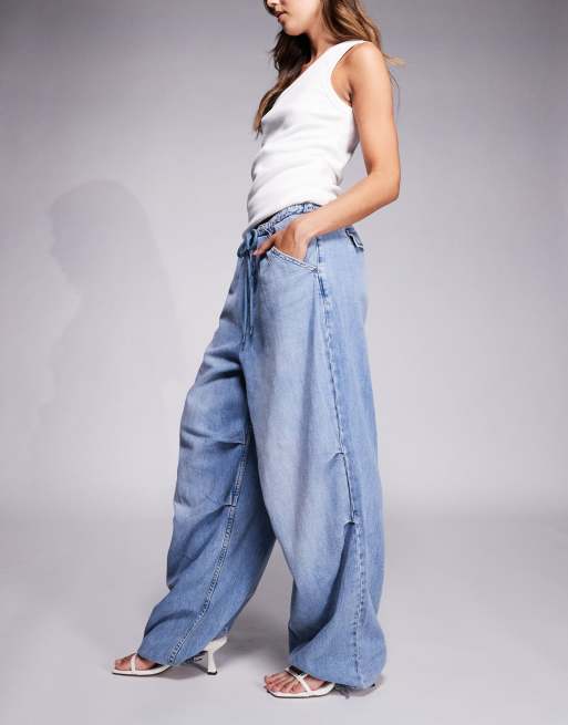 Good American lite linen look denim parachute pants in mid