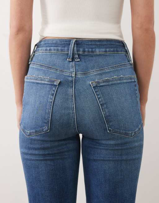 Good American Petite frayed hem flared jeans in mid blue wash, 5 of 5