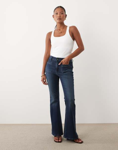 Good American Petite Soft Touch Good Waist flare jeans in dark wash blue - view 1