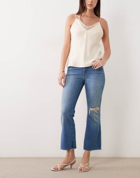 Good American – Soft Tech – Good Legs – Mellanblå, tvättade och ankellånga jeans med revor - view 1