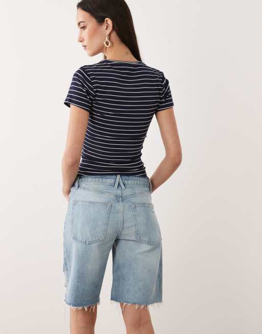 Good American vintage mid rise Bermuda denim shorts in light blue wash, 5 of 5