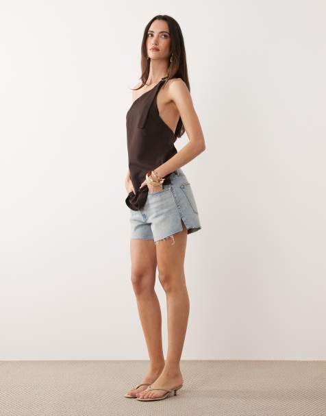 Good American vintage mid rise longline denim shorts in light blue wash - view 1