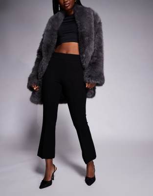 Good American - Weiche Schlaghose in Schwarz aus Stretch-Ponte