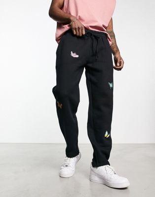 Good For Nothing co-ord oversized straight leg joggers in black with butterfly placement prints and hem split
