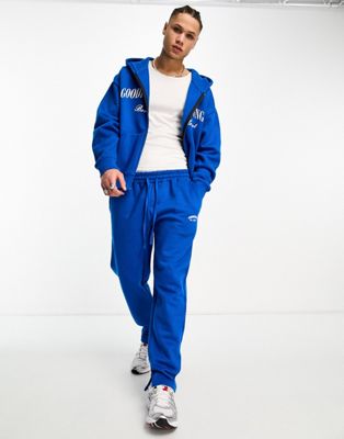 Good For Nothing co-ord straight leg joggers in cobalt blue with logo print and hem split