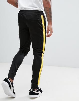 Yellow joggers with store black stripe