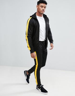 yellow joggers black stripe