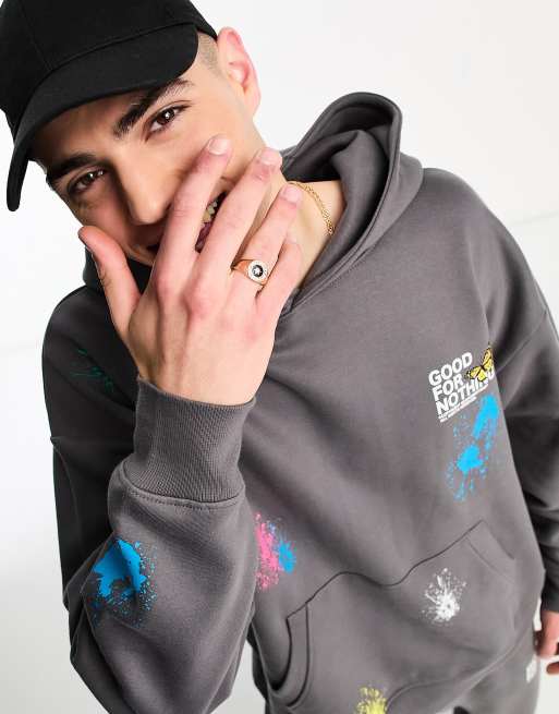 Good For Nothing oversized hoodie in grey with logo print and paint splatter part of a set