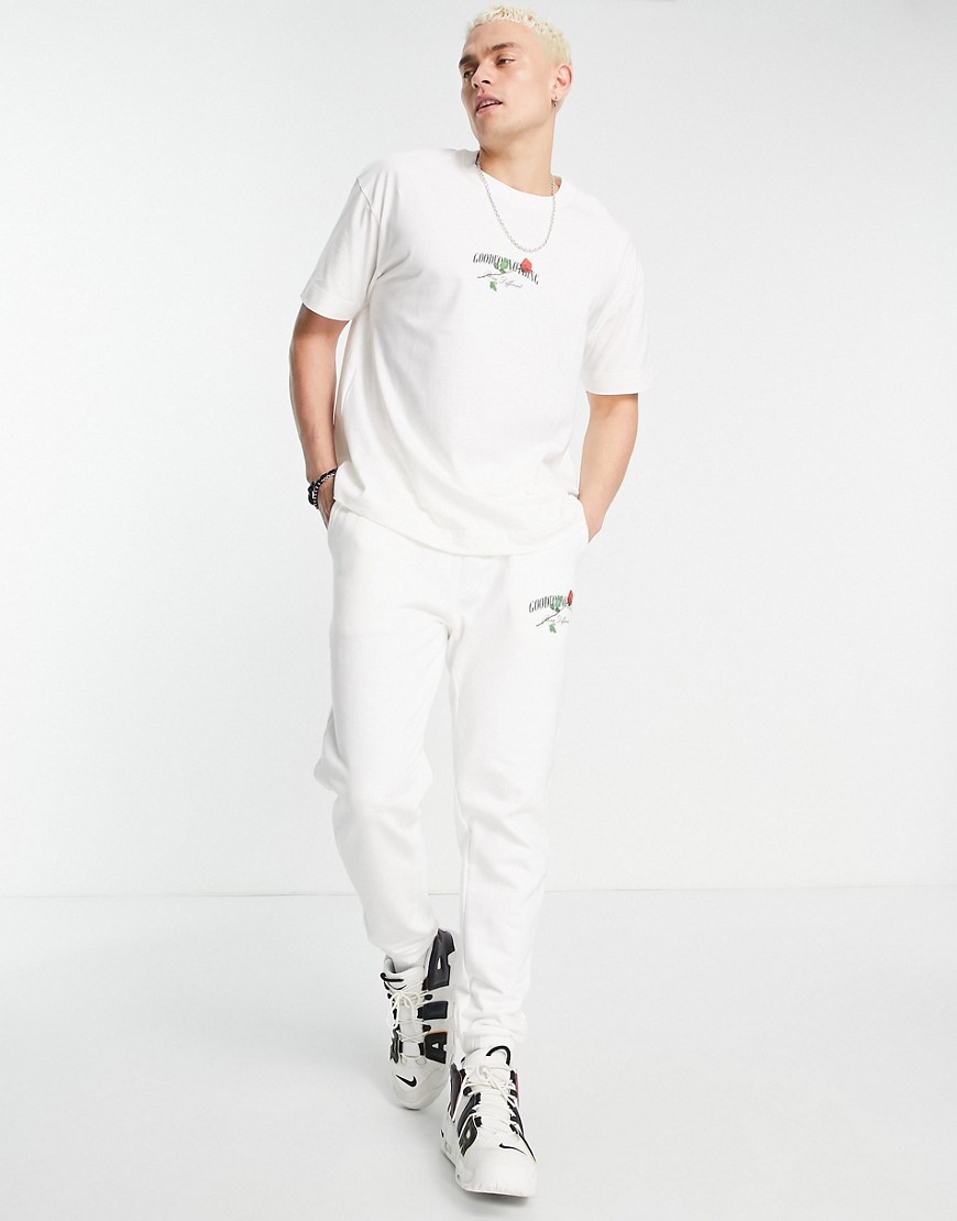 relaxed jersey sweatpants in off white with rose logo print - part of a set
