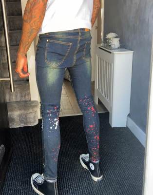 black ripped jeans paint splatter