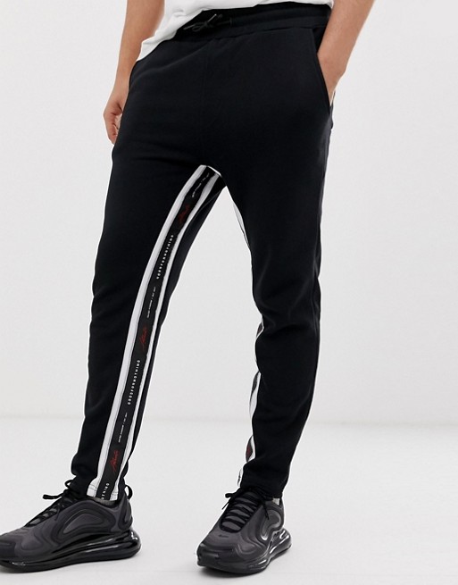 Good For Nothing skinny cropped joggers in black with logo side stripe ...