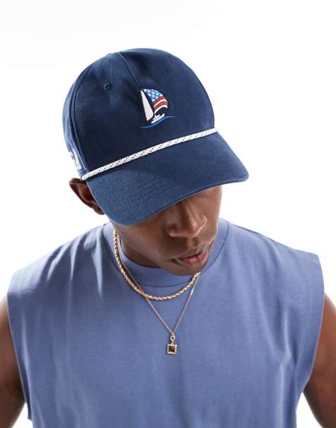 Gorra azul marino con botón de presión y detalle de motivo estadounidense de Hollister - view 1