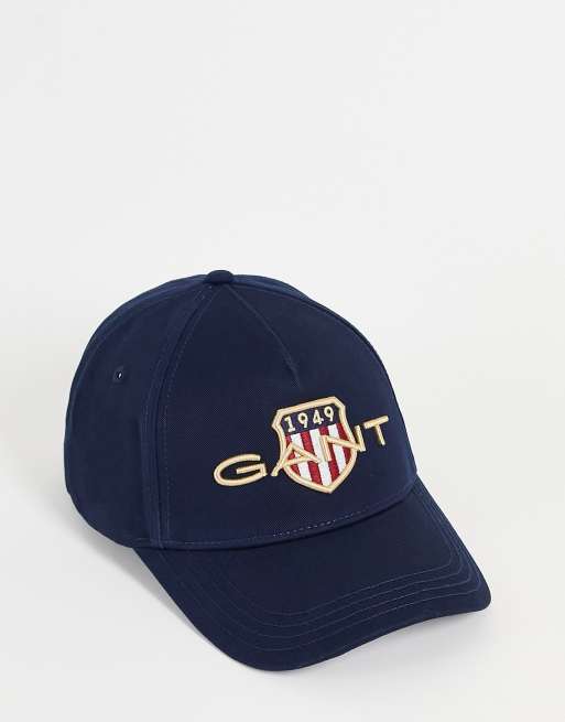Gorra azul marino con logo de escudo de GANT