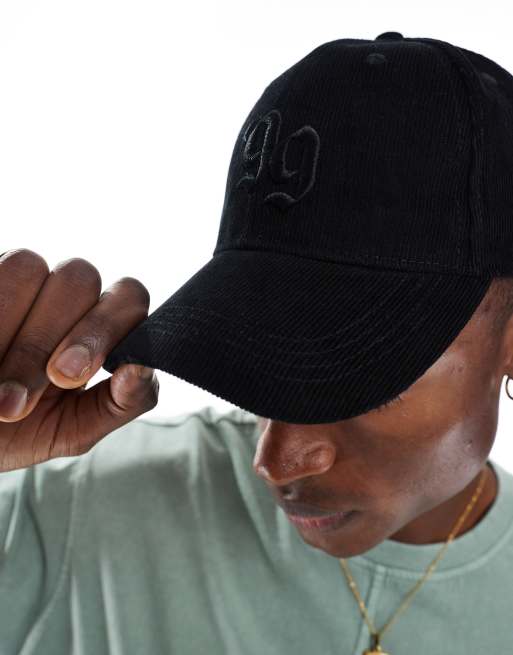 Gorra de béisbol negra con detalle gráfico de pana de ASOS DESIGN, 2 de 3