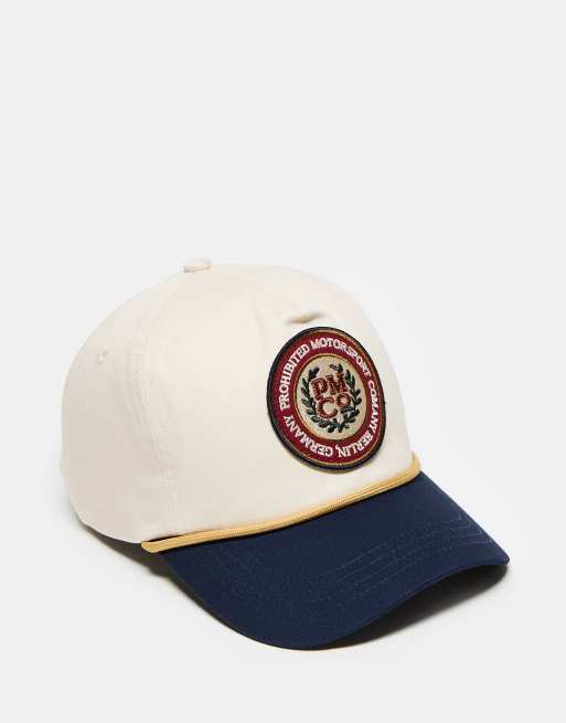 Gorra multicolor con visera en contraste y logo de emblema de Prohibited