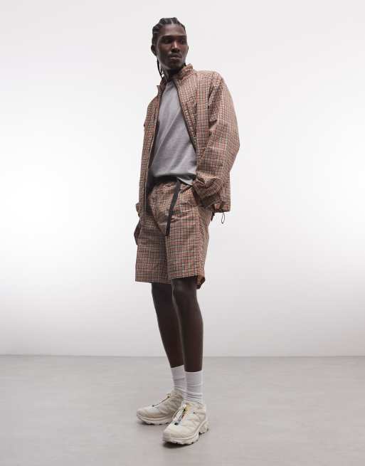 Gramicci - Giacca shell con zip e pantaloncini color mattone a quadri in coordinato