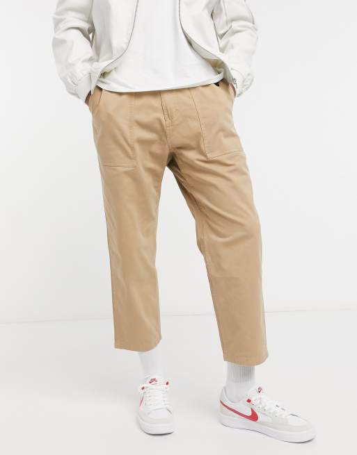 Gramicci – Locker geschnittene Karottenhose in Stone