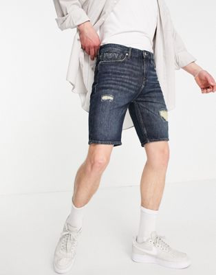 Guess distressed denim shorts in light blue wash