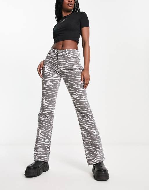 GUESS® Zebra print bootcut denim pant