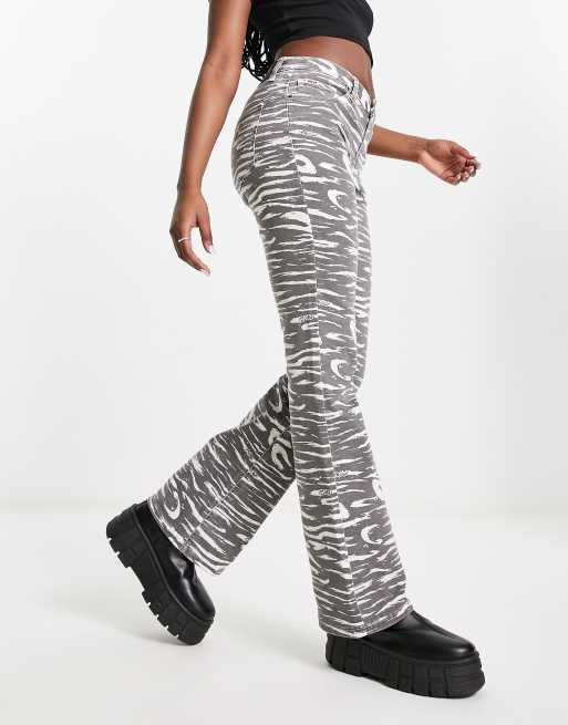 GUESS® Zebra print bootcut denim pant