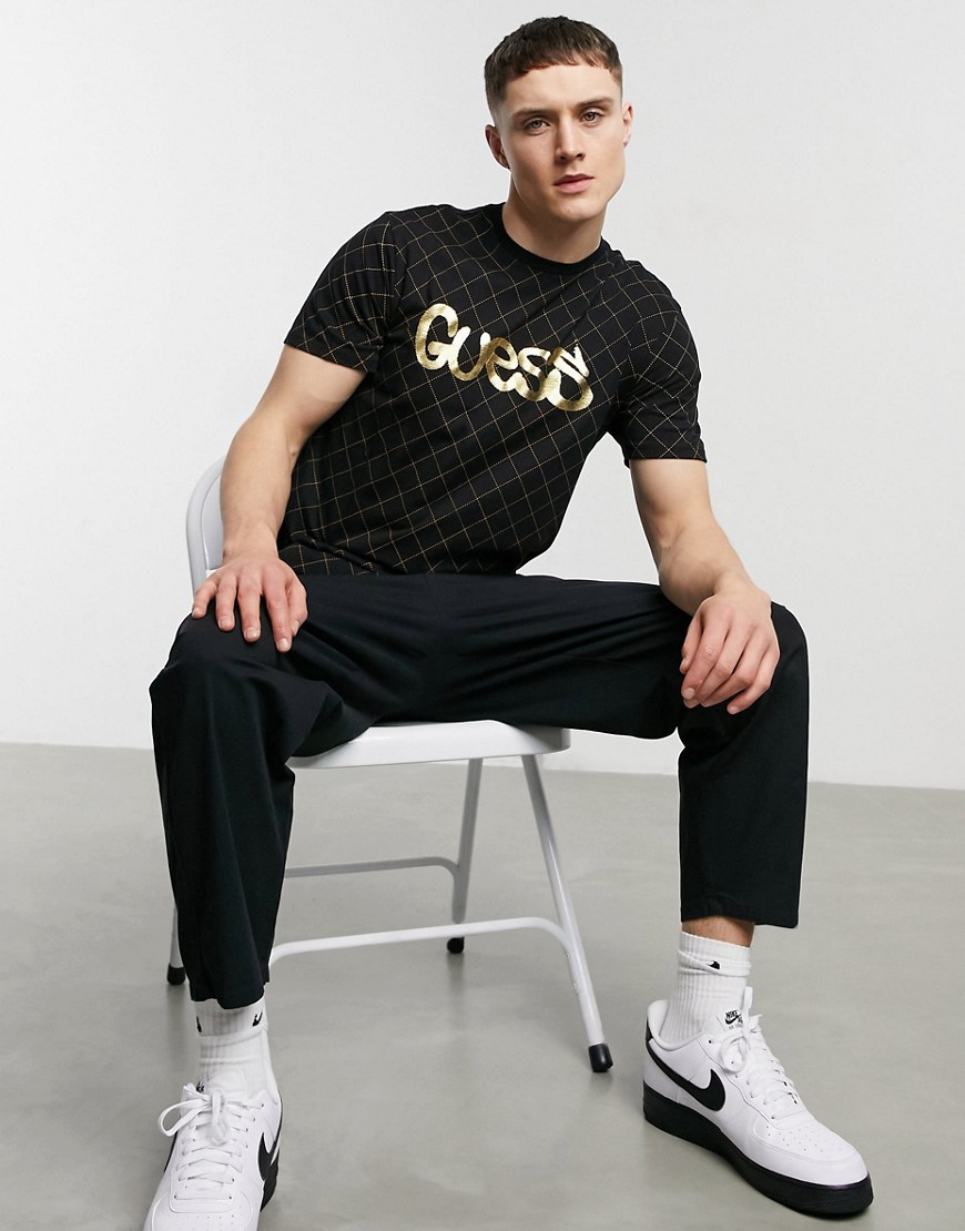 Guess t-shirt with gold text logo in black