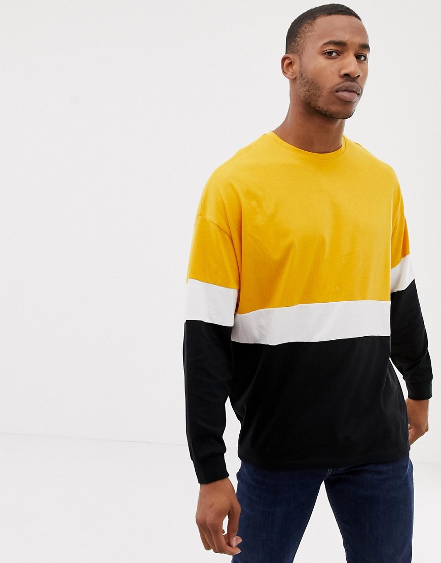 Gulfarvet langærmet t-shirt med farveblokke i longline oversized model fra ASOS DESIGN