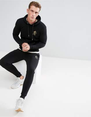 gym king black and gold joggers
