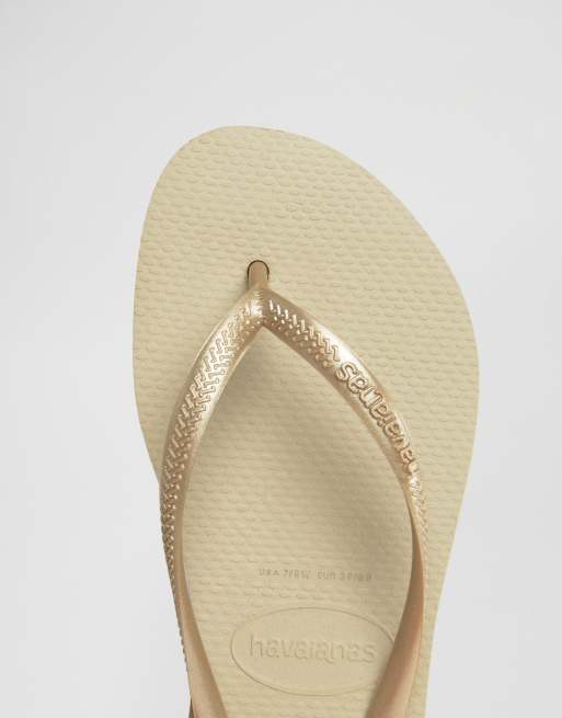 Gold havaiana hot sale flip flops