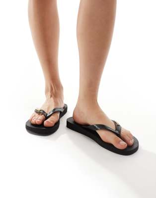 Havaianas - Klassische Zehenstegsandalen in Schwarz mit Metall-Logo