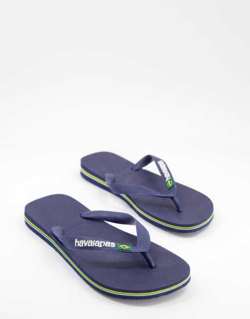 Havaianas – Marinblå flip flops i läderimitation med logga