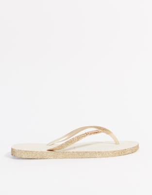 gold sparkly flip flops