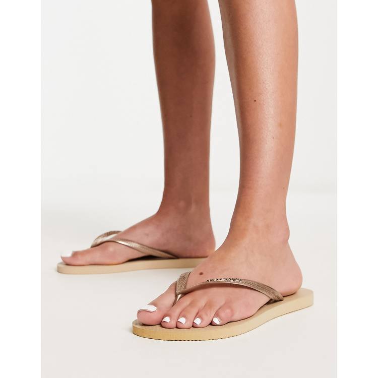 Havaianas Slim flip flops in metallic gold ASOS