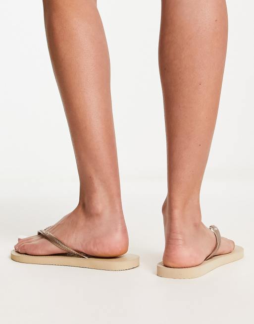 Havaianas Slim flip flops in metallic gold ASOS