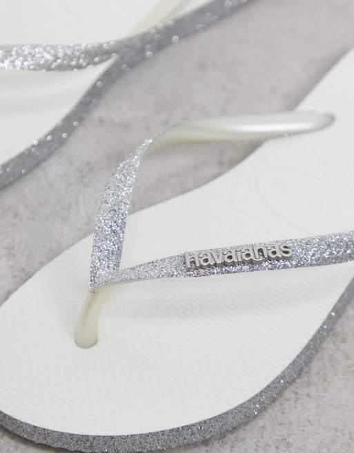 Havaianas slim flip flops in silver sparkle