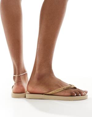 Havaianas slim glitter flip flops in golden sand