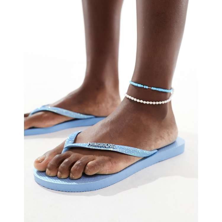 Havaianas slim glitter iridescent flip flops in blue