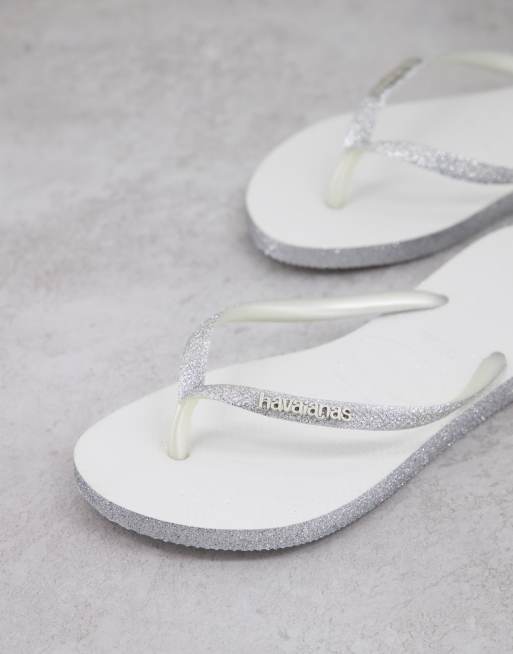 White sparkle deals flip flops