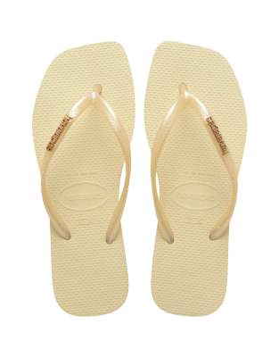  slim square toe metalic logo flip flops in buttercream