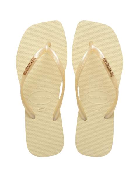 Havaianas - Smalle teenslippers met vierkante neus en metallic logo in botercrème - view 1